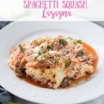 White circular plate of Spaghetti Squash Lasagna topped with fresh basil and