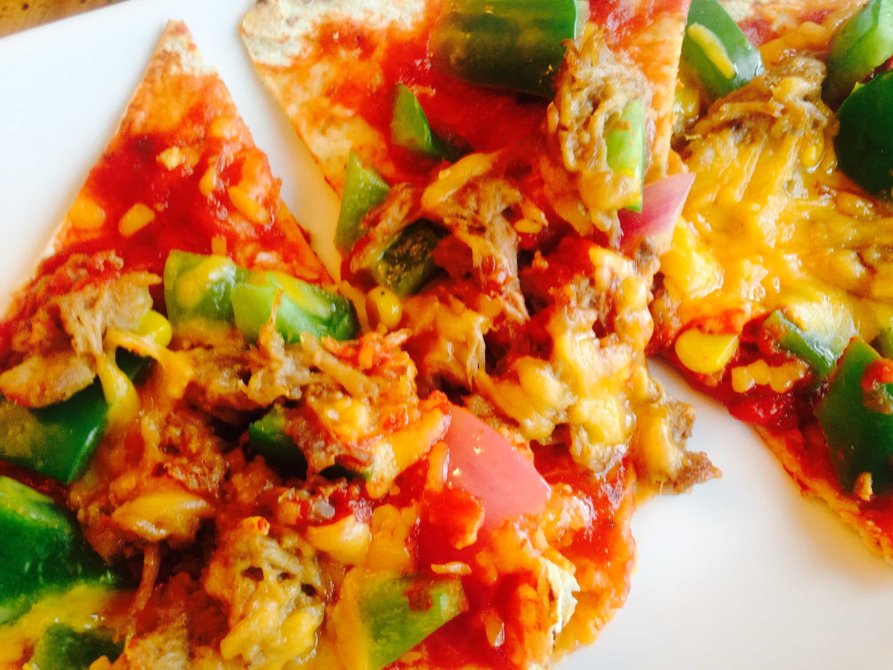 Pork Enchiladas Flatbread Pizza - a healthy comfort food, made with leftover pork carnitas, homemade enchilada sauce, peppers, onions, and cheddar cheese. It is a delicious, 21 Day Fix approved meal! 