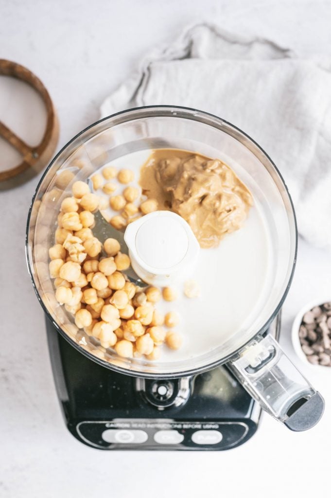 Chickpeas and nut butter in a food processor