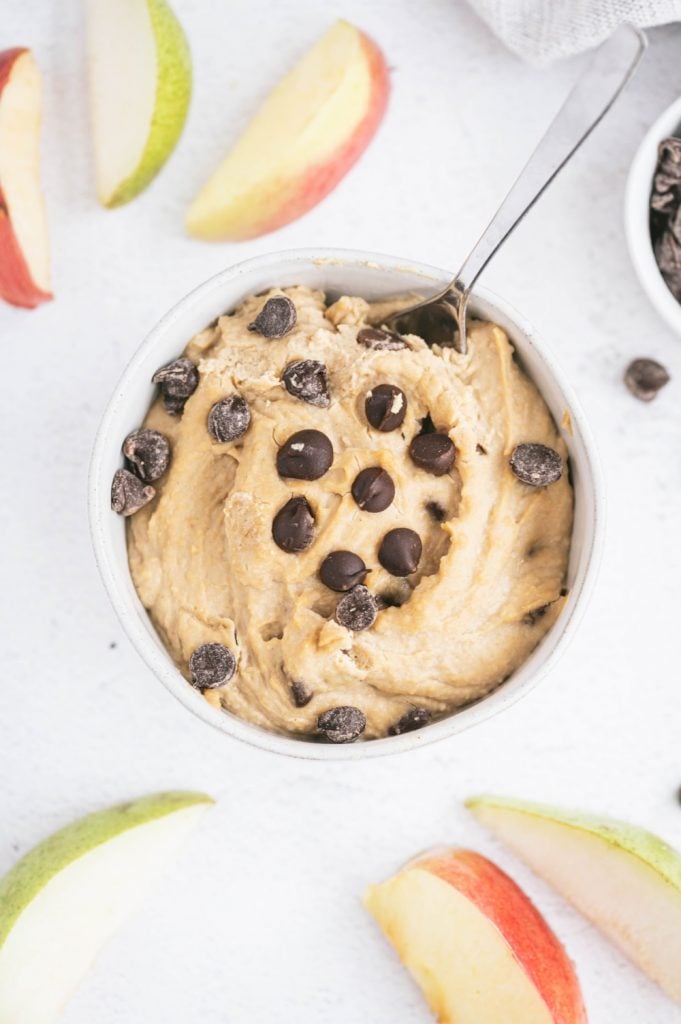 Overhead shot of a bowl of cookie dough dip and apples