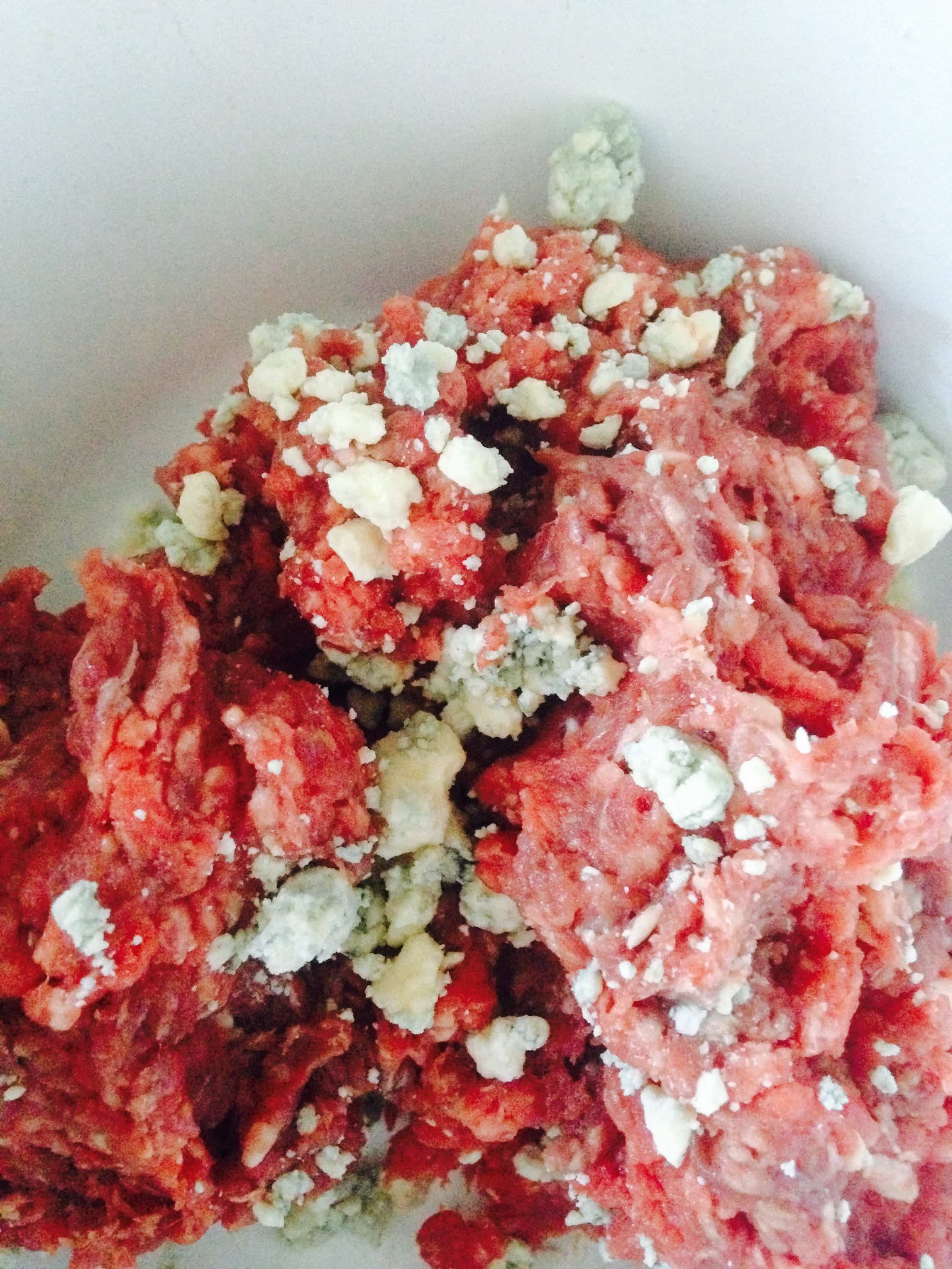 raw ground sirloin with blue cheese crumbles in a bowl