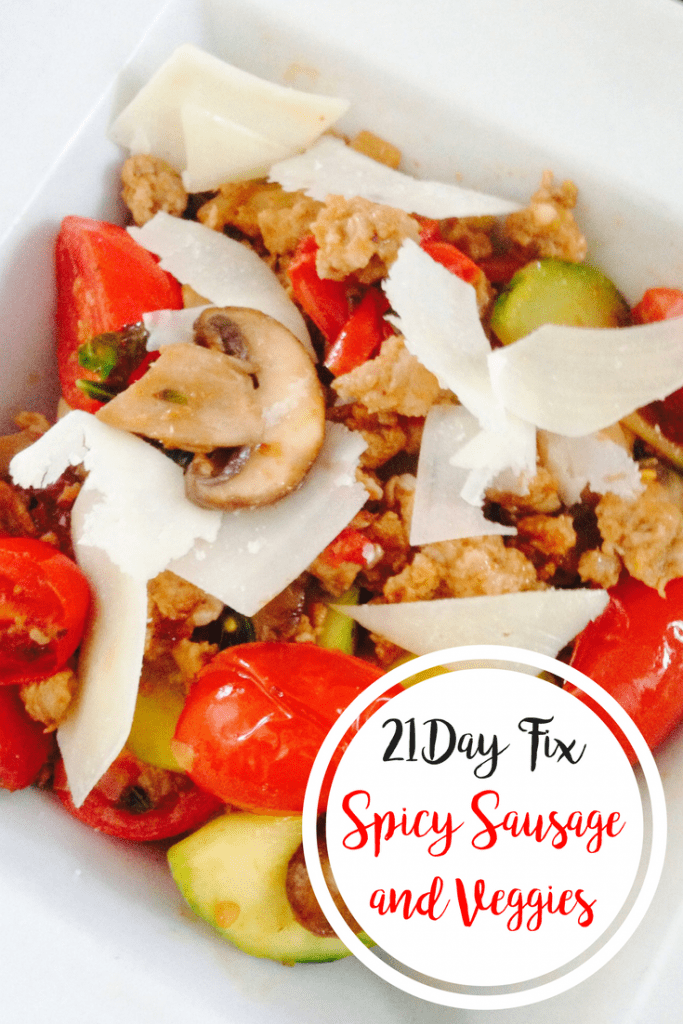 Spicy Sausage cooked with mushrooms, grape tomatoes, and zucchini and topped with shaved parmesan cheese in a white square bowl