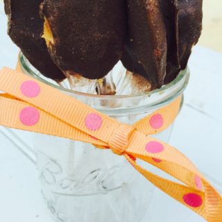 Frozen chocolate peanut butter on a spoon is the ultimate frozen treat for anyone on the 21 Day Fix! Tastes just like a frozen peanut butter cup! Recipe on ConfessionsOfAFitFoodie.com