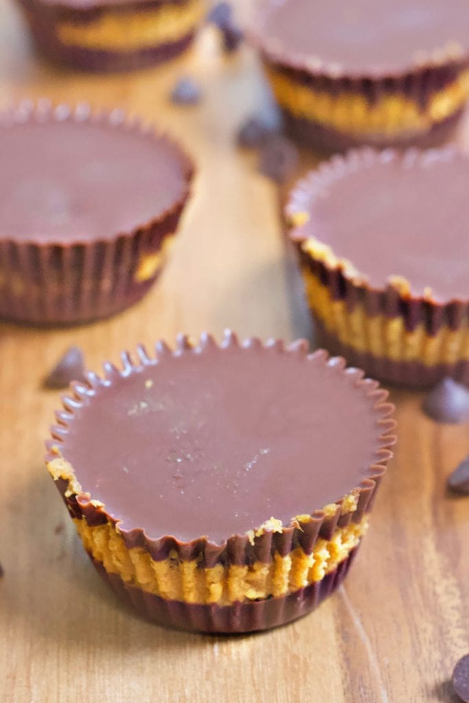 Homemade pumpkin chocolate chip cups on a wooden table