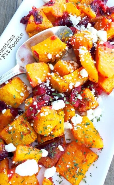 Warm Honey Roasted Butternut Squash Salad, with fresh cranberries and goat cheese. Recipe from Confessions of a Fit Foodie