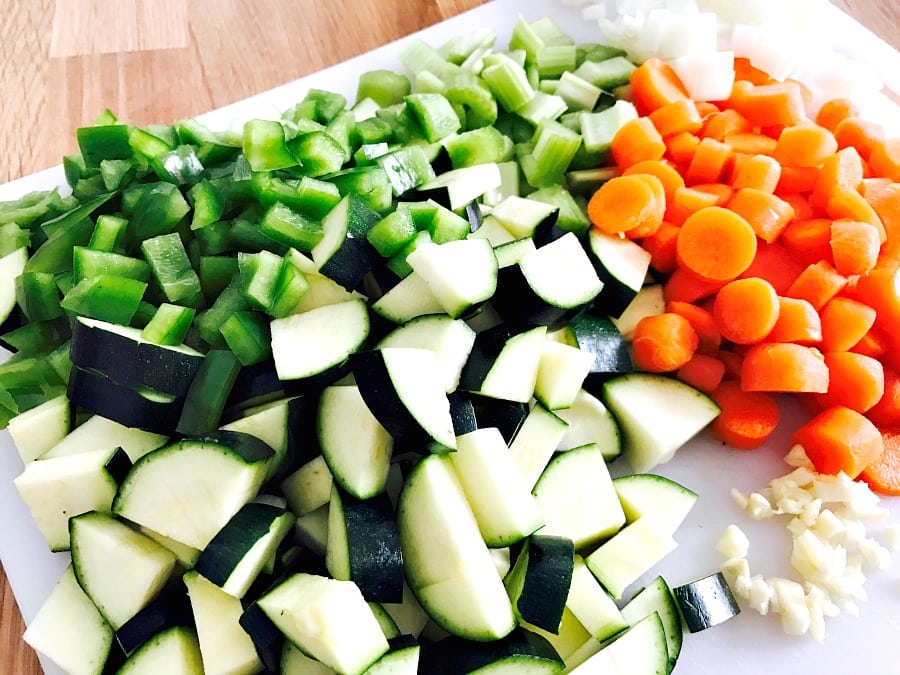 Chopped veggies on a white cutting board