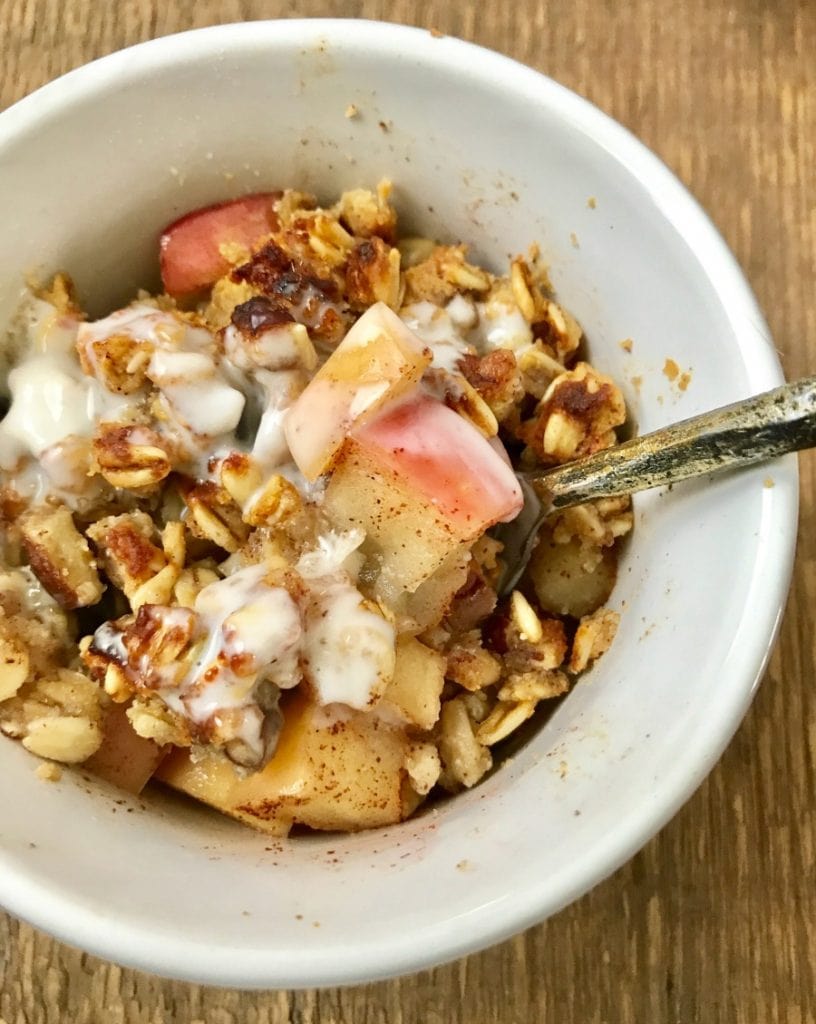 A close up shot of delicious Apple Crisp topped with oats and almond flour