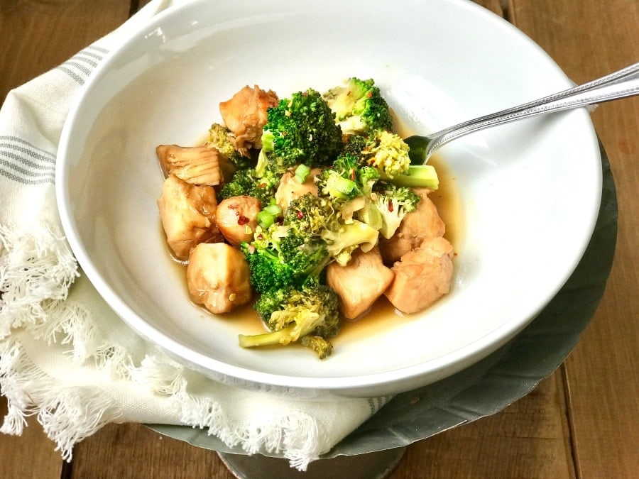 A white bowl with 21 Day Fix Instant Pot Chicken and Broccoli sitting on a metal tray 