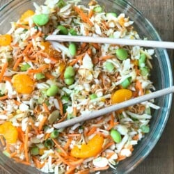 Ramen Noodle Salad in a Glass Bowl with Wooden tongs