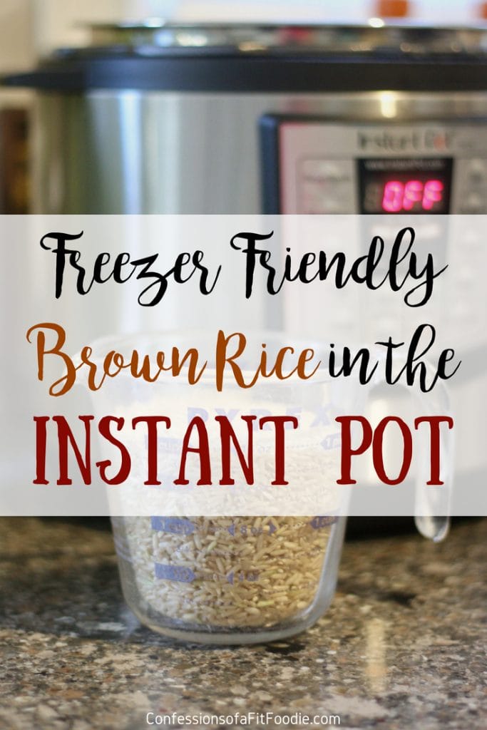 Glass measuring cup filled with brown rice with an Instant Pot in the background, with the text overlay- Freezer Friendly Brown Rice in the Instant Pot | Confessions of a Fit Foodie