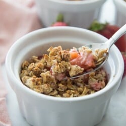 Ramekin with a Spoon full of Healthy Strawberry Rhubarb Crisp