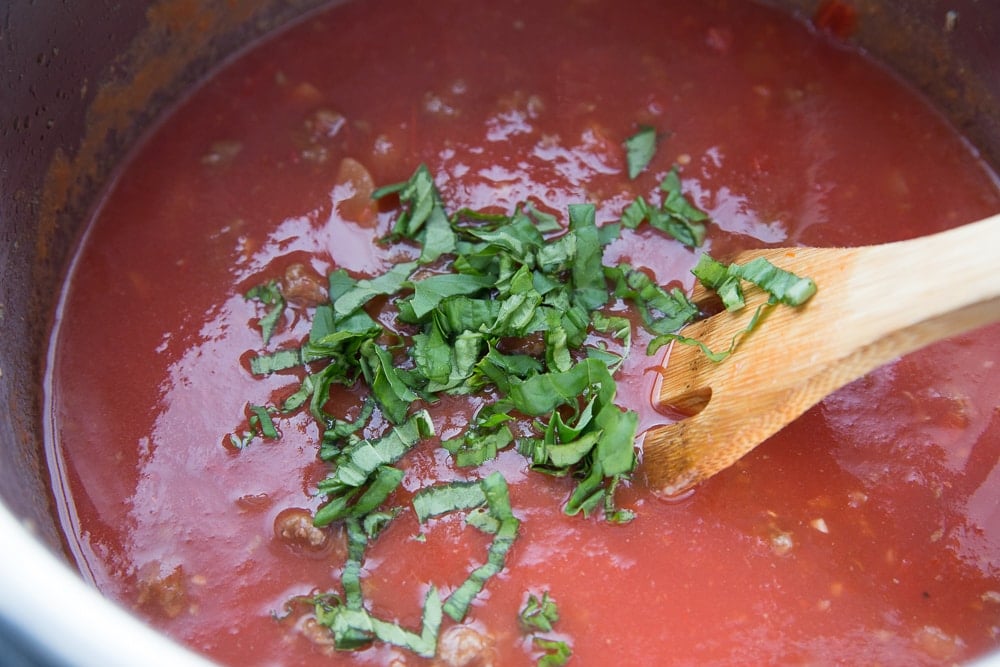 Instant Pot Lasagna soup topped with a ton of fresh basil