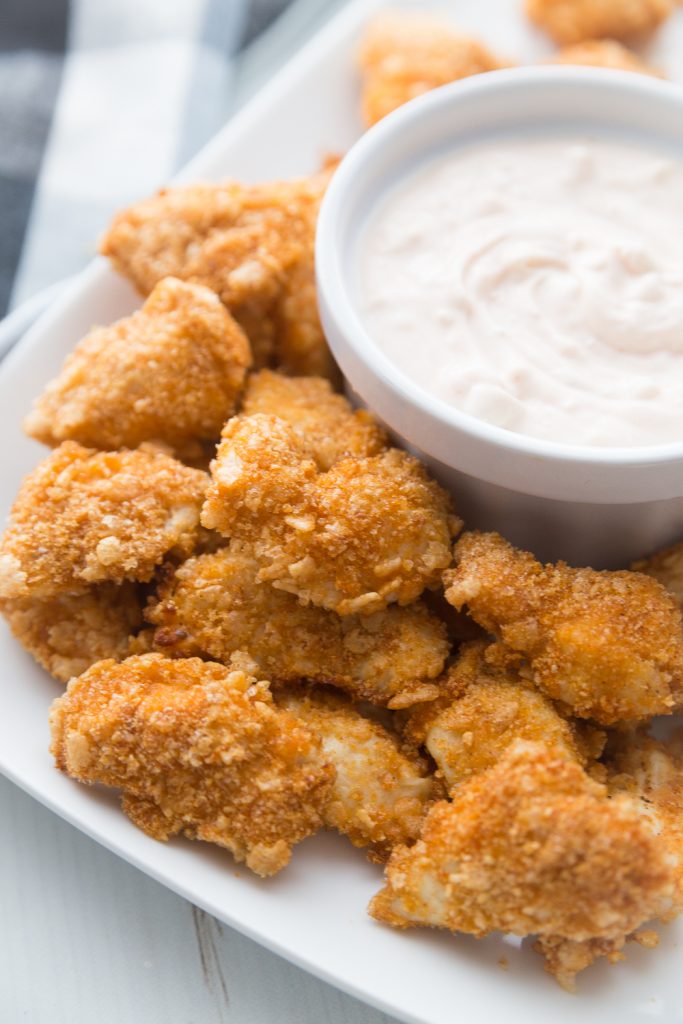 A white platter of Airfryer Buffalo Chicken Nuggets made with Gluten-free Brown Rice Cereal
