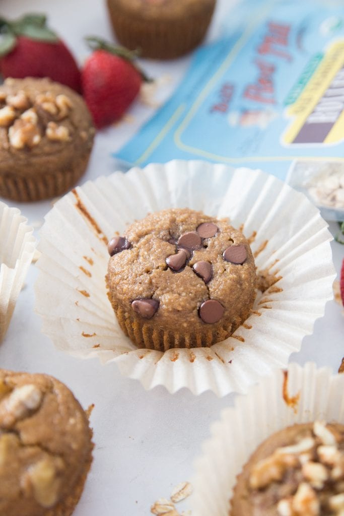 A bag of gluten free bob's red mills oats sit in the backround of a photo with Oatmeal Blender Muffins