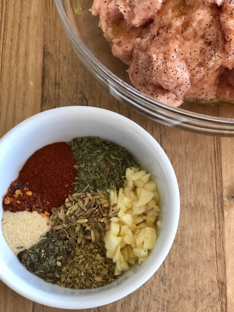 Seasoning mix for Italian Chicken Sausage or Italian Turkey Sausage on a wood table 