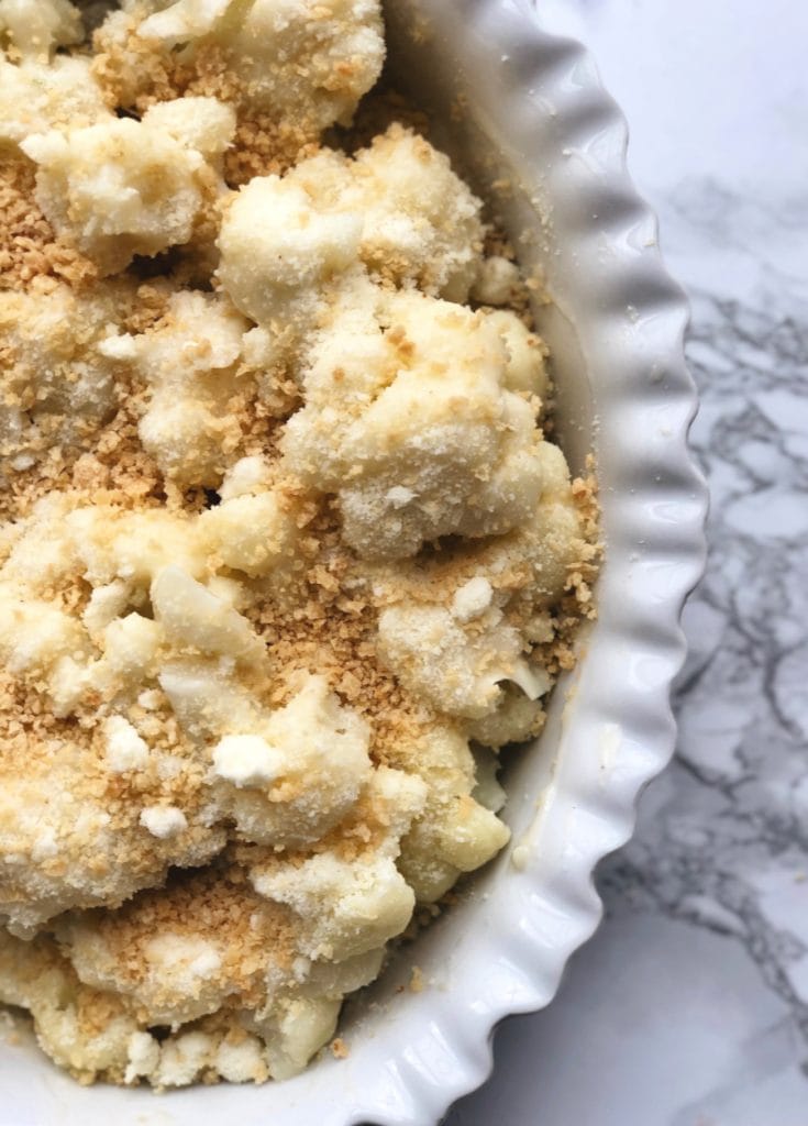 Low Carb Cauliflower Au Gratin sitting on a marble background 