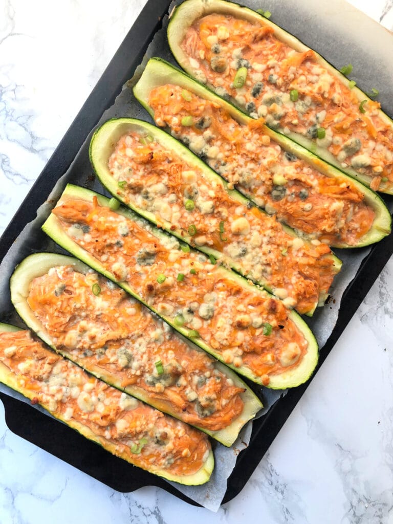 A delicious looking tray of Low Carb Buffalo Stuffed Zucchini Boats 