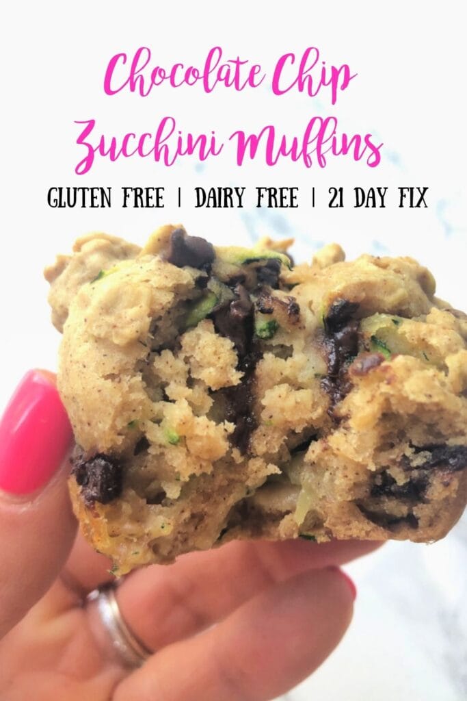 Close up photo of a woman's hand holding a muffin with the text overlay- Chocolate Chip Zucchini Muffins | Gluten Free | Dairy Free | 21 Day Fix 