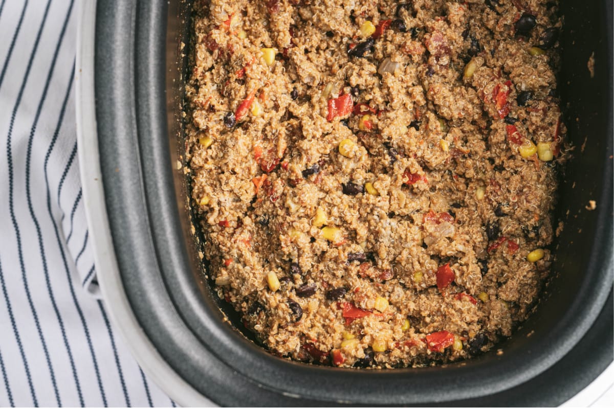 Overhead photo of crock pot taco casserole made with ground turkey, quinoa, diced tomatoes, corn, and black beans.