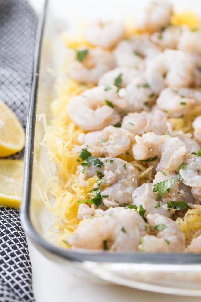 shrimp scampi ingredients in glass casserole dish