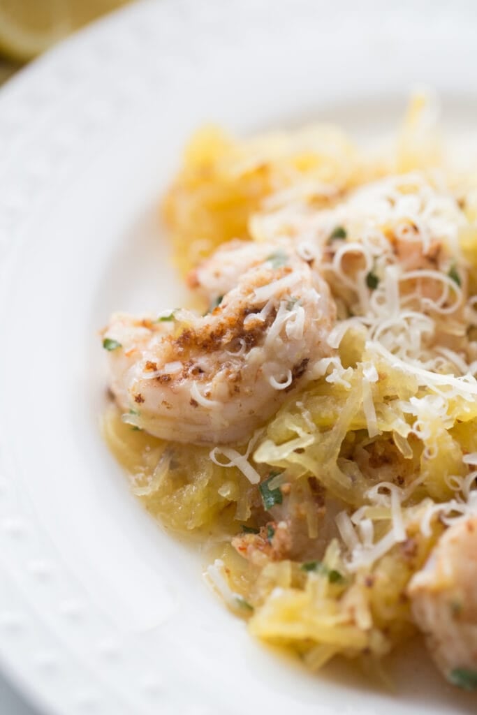healthy, low carb dinner of shrimp scampi with spaghetti squash on a white plate