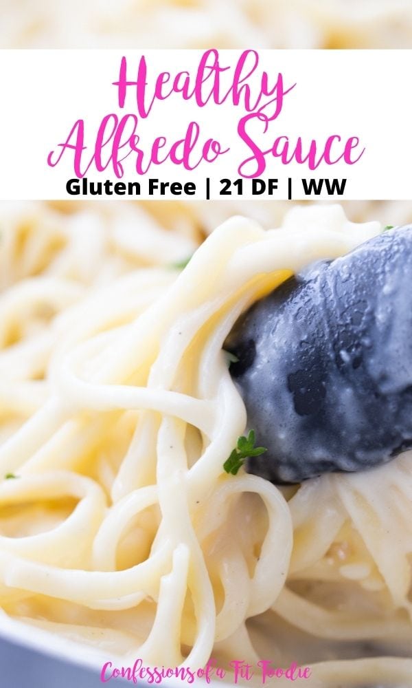 Close up photo of black kitchen tongs gathering fettuccine alfredo with a black and pink text overlay on a white rectangle. The text says, Healthy Alfredo Sauce | Gluten Free | 21 DF | WW | Confessions of a Fit Foodie 