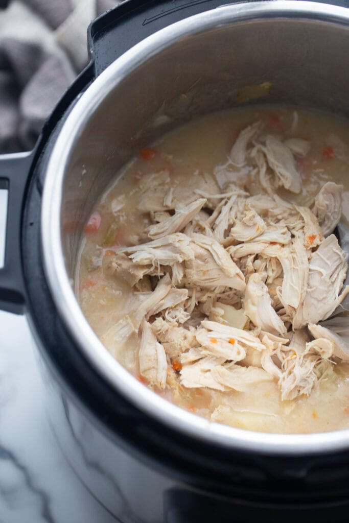 Shredded chicken is in the Instant Pot.