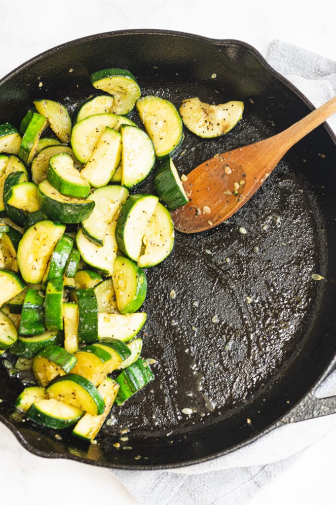 Sauteed zucchini in a cast iron pan 
