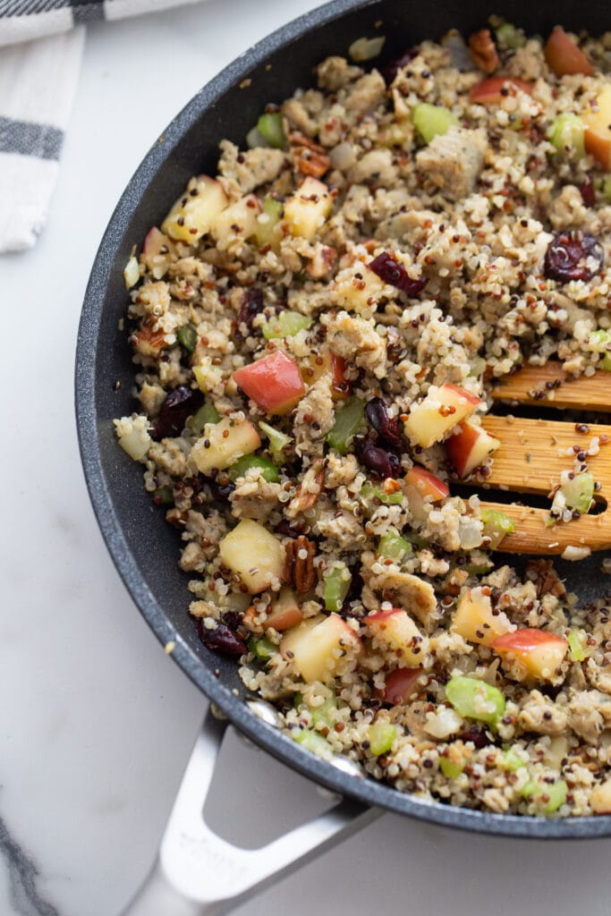 Overhead image: sweet and savory stuffing for acorn squash in a pan
