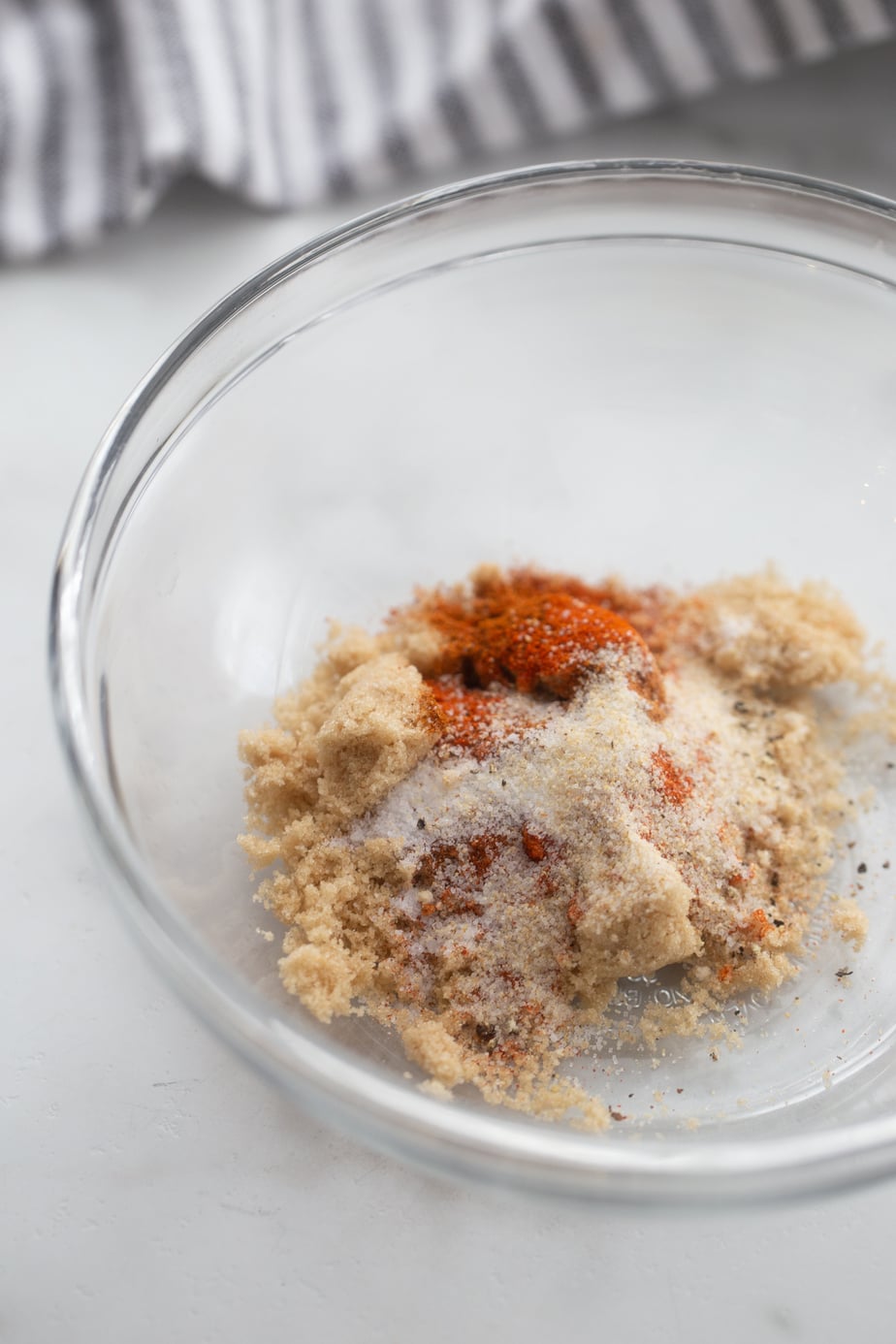 Spice blend for pork tenderloin in a glass bowl, not mixed. 
