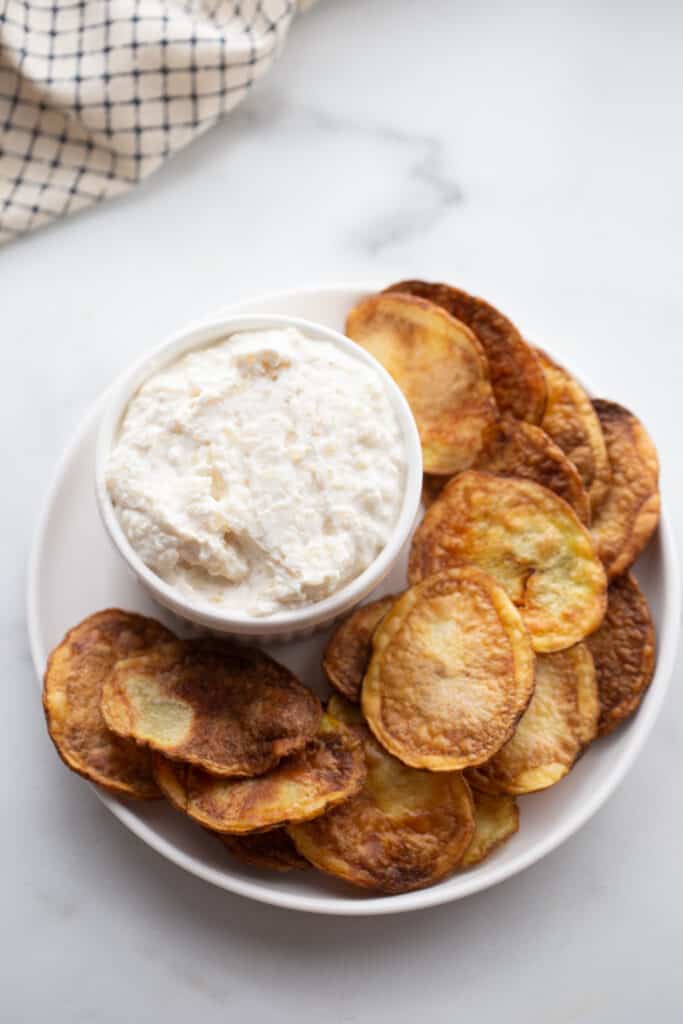 A plate of Air Fryer Potato Chips with Greek yogurt French Onion Dip. 