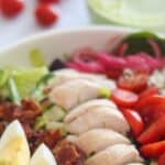 This copycat recipe for Panera Green Goddess Salad with lean chicken breast and crispy bacon and is topped with Panera's signature pickled onions and famous green goddess salad dressing for the most delicious cobb salad ever.   It's a low carb, high protein, perfect for meal prep lunch or dinner that you can make right at home!