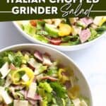 Pinterest image for the tik tok famous grinder salad in a white bowl on a white marble background.