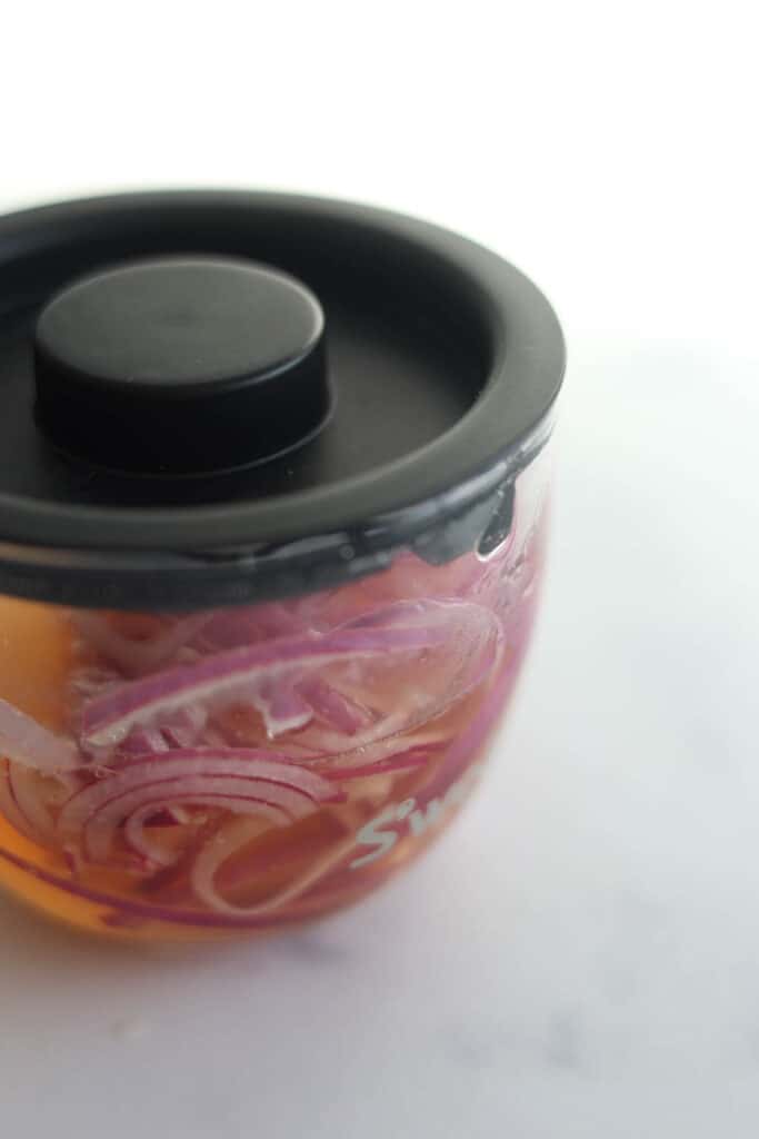 Quick pickled red onions for Green Goddess Salad.