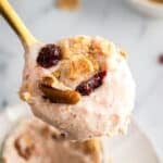 Carrot cake cheesecake cups with crumbled graham crackers and raisins on top.