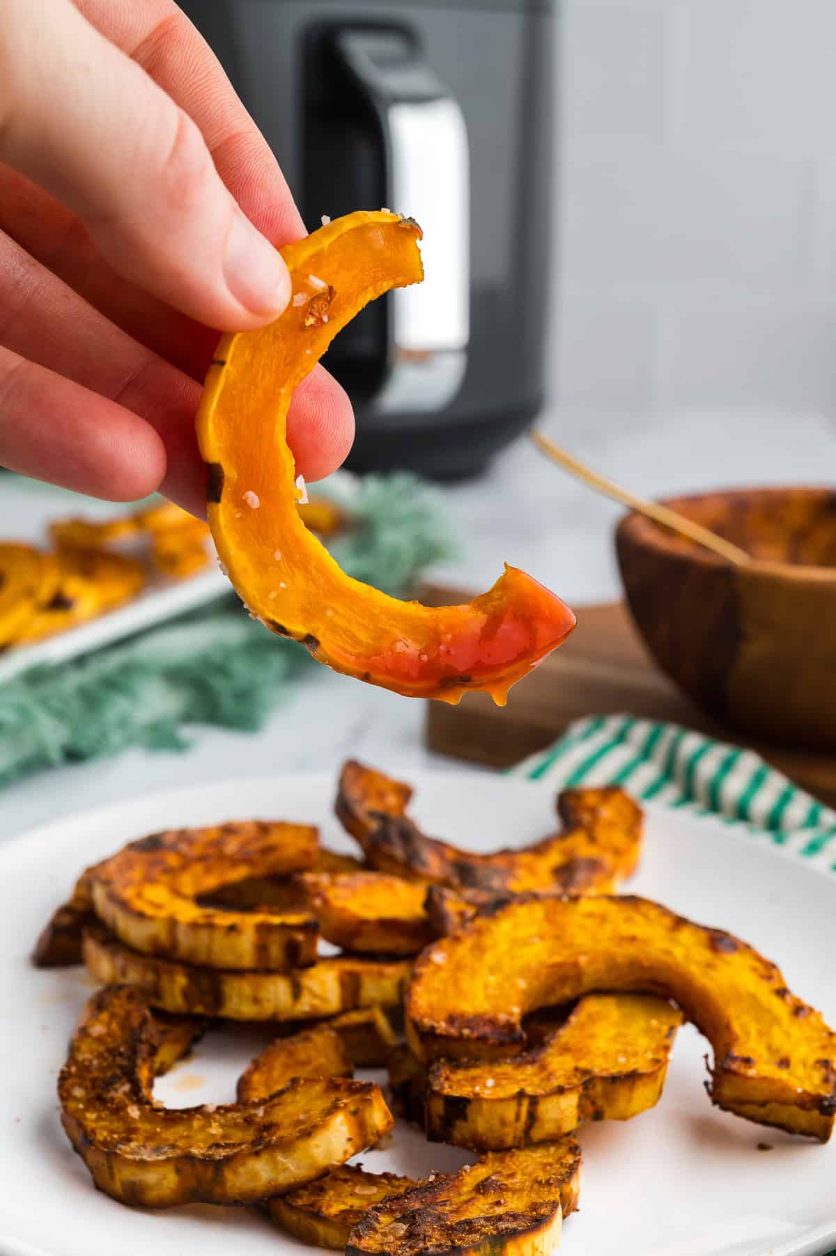 Roasted delicata squash dipped in ketchup.