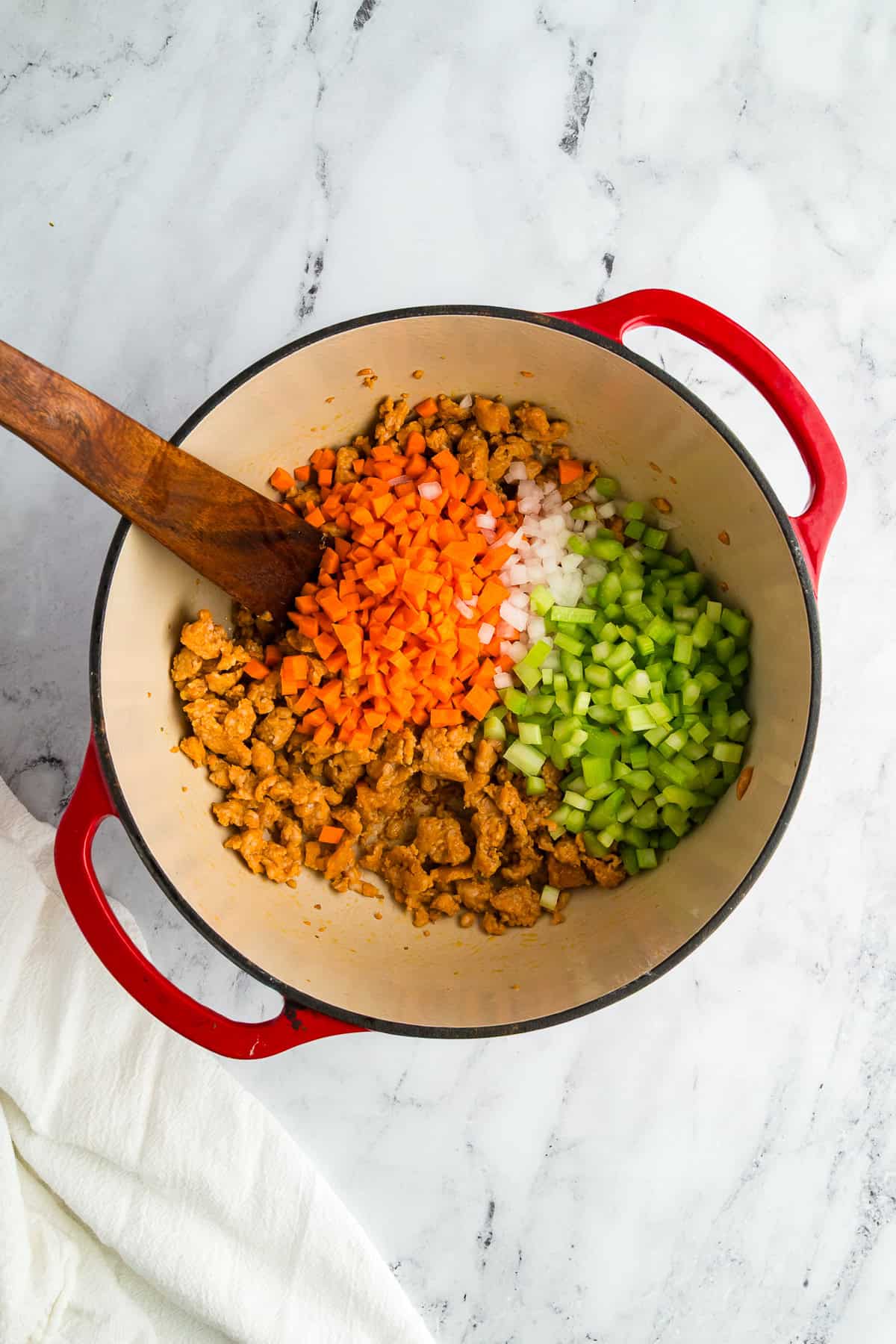 Diced onion, celery, and carrots added to the pot and sautéed until softened.